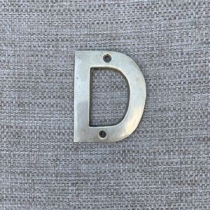 Vintage “D” solid brass letter